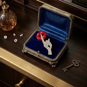 Luxury red lip and crystal-encrusted shushing finger brooch inside a vintage blue velvet box