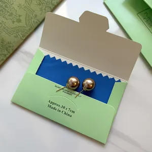 Double-sided microfiber silver polishing cloth for jewelry in a lime green paper envelope