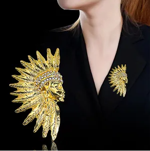 Vintage Egyptian Pharaoh head brooch in gold with rhinestones, shown on a blazer lapel