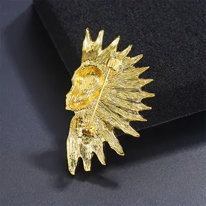 Back view detail of a vintage golden Egyptian Pharaoh head brooch with safety pin