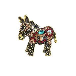 Exquisite vintage donkey brooch featuring colorful rhinestones on gold-toned metal base