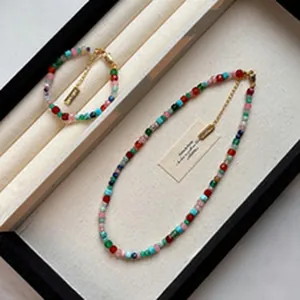 Handmade colorful beaded necklace and bracelet set displayed in a premium jewelry tray