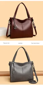 Detail view showing stylish cowhide leather shoulder bags in both burgundy and grey colors