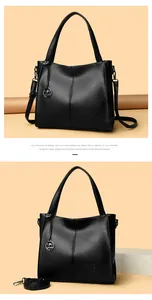 Detailed view of black pebbled leather tote bag with elegant kangaroo charm