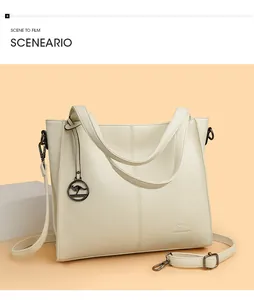 Elegant large capacity cream leather shoulder bag with decorative kangaroo charm