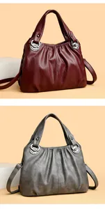 Comparativa de bolsos de cuero plisado en color granate y gris de gran capacidad para mujer