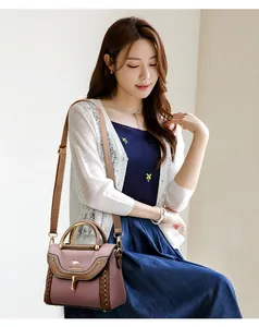 Elegant pink and brown woven color-block crossbody small square bag shown on model
