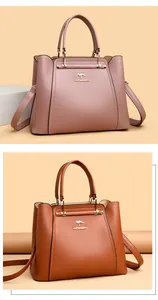 Elegante bolso de mano y bandolera para mujer en rosa palo y marrón