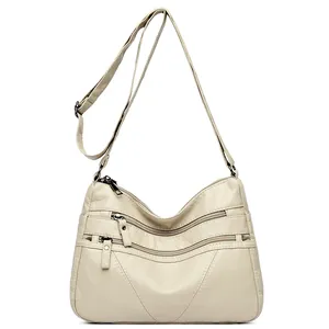 Vintage cream washed leather crossbody bag with multiple front zipper pockets for women