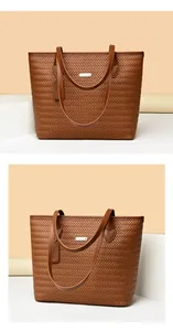 Close-up view of the high-quality brown woven PU leather tote bag with logo plate detail