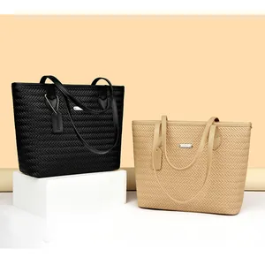 Elegant black and beige woven PU leather tote bags for women presented in a studio