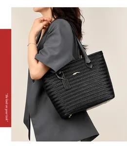 Elegant black woven PU leather tote bag shown on model for stylish daily commuting