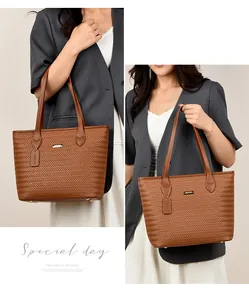 Detailed view of a brown woven PU leather tote bag with elegant model styling for daily wear
