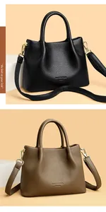 Detalle de bolsos de cuero granulado negro y taupe con correas ajustables