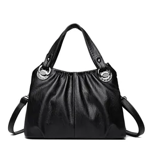 Bolso de mano clásico de cuero suave negro con diseño plisado y correa ajustable