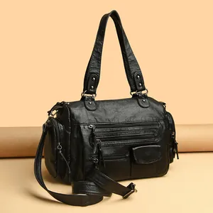 Bolso de mano estilo motero negro con múltiples bolsillos y correa ajustable larga