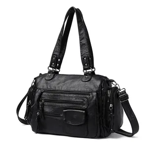 Bolso de mano estilo motero negro con múltiples bolsillos y correas muy versátiles