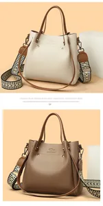 Elegante bolso de mujer en color blanco roto y marrón con correa ancha tejida
