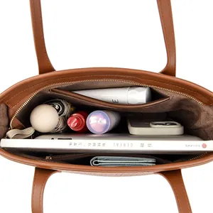 Inside view of a large capacity brown PU leather tote bag showing spacious interior