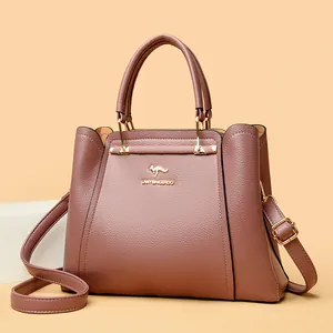 Bolso de mano elegante en cuero granulado malva para mujer con logo de canguro dorado