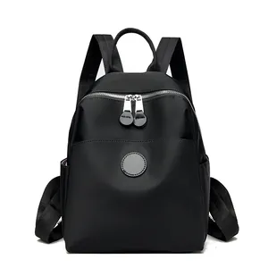 Sleek black waterproof nylon backpack for women's daily commute and travel