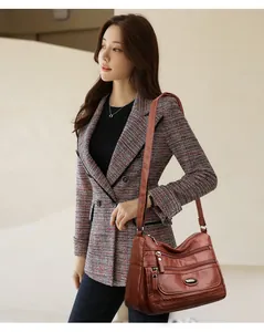 Stylish washed leather shoulder bag for women with large capacity and multi-zippers.