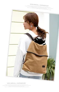 Casual brown canvas backpack for women worn by a model in an outdoor lifestyle setting