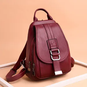 Stylish burgundy soft leather women's backpack featuring an elegant embossed kangaroo logo