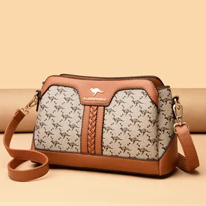 Elegant women's crossbody bag with kangaroo pattern print and brown leather trim design
