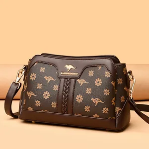Vintage brown floral print crossbody bag for women with kangaroo logo and gold hardware