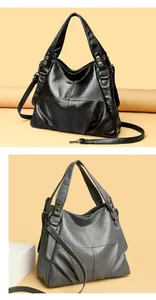 Vista detallada de los bolsos tote de cuero PU en negro y gris con diseño de patchwork
