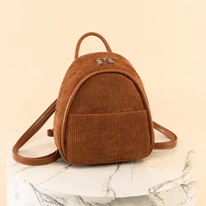 Stylish brown corduroy mini backpack for women, ideal for casual travel and daily use