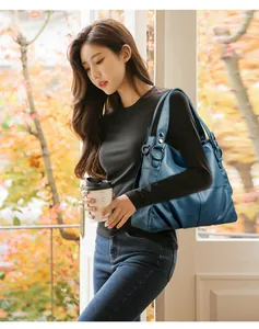 Elegante bolso de mano de cuero PU azul para mujer con diseño minimalista de retazos.