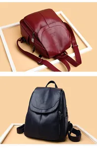 Détail de sacs à dos élégants en cuir souple pour femmes en rouge foncé et bleu marine