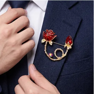 Elegant red rose enamel flower brooch pin with red crystals on a navy suit lapel