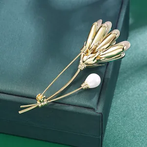 Luxury flower brooch featuring a white pearl and 14k gold-plated brass with K9 glass details