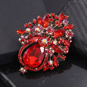 Vintage ornate flower basket brooch with red crystals and antique gold finish for women