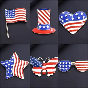 Collection of American flag enamel pins in star, heart, and butterfly shapes.