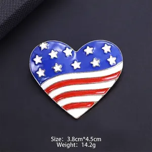 Detailed close-up of heart-shaped American flag enamel brooch with stars and stripes