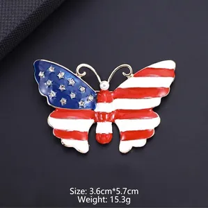 Detail view of an enamel butterfly brooch with American flag star and stripe pattern.