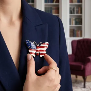 American flag butterfly brooch pin with enamel finish on navy blue blazer