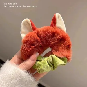 Cute plush fox ear scrunchie with orange faux fur and green velvet for winter