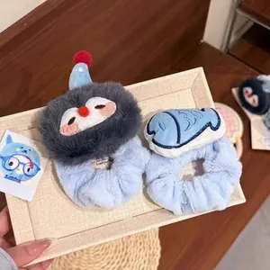 Set of two plush cartoon penguin and fish hair scrunchies for cute Korean style hair