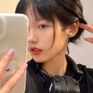 Sparkling zircon magnetic stud earrings for non-pierced ears worn by a model