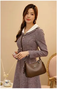 Detailed shot of a stylish retro brown soft leather crossbody handbag for women