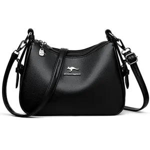 Vintage black soft leather shoulder bag with adjustable strap and kangaroo logo detail