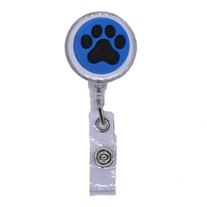 Close-up of blue retractable ID badge reel featuring a black cat paw print design