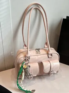 Premium pink underarm shoulder bag for women featuring large capacity and stylish front pockets.