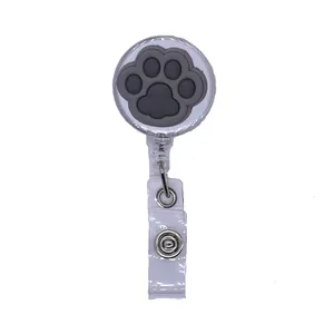 Cute retractable badge reel holder featuring a grey silicone cat paw print design