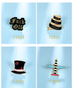 Detail view of four cartoon enamel pins featuring unique text and airplane shapes
